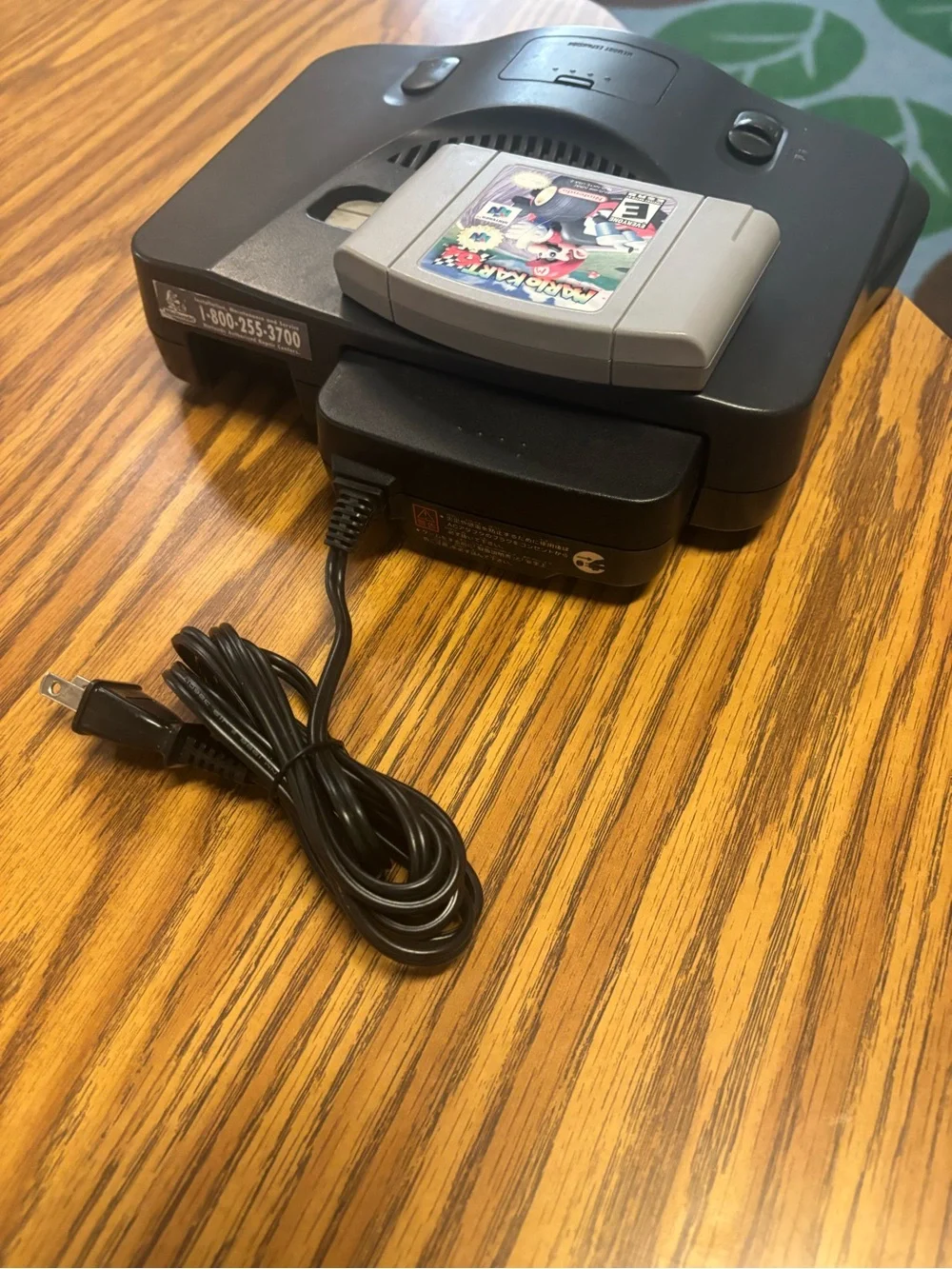 Nintendo N64 Console with Gray Mario Kart 64 Cartridge and Black Power Adapter